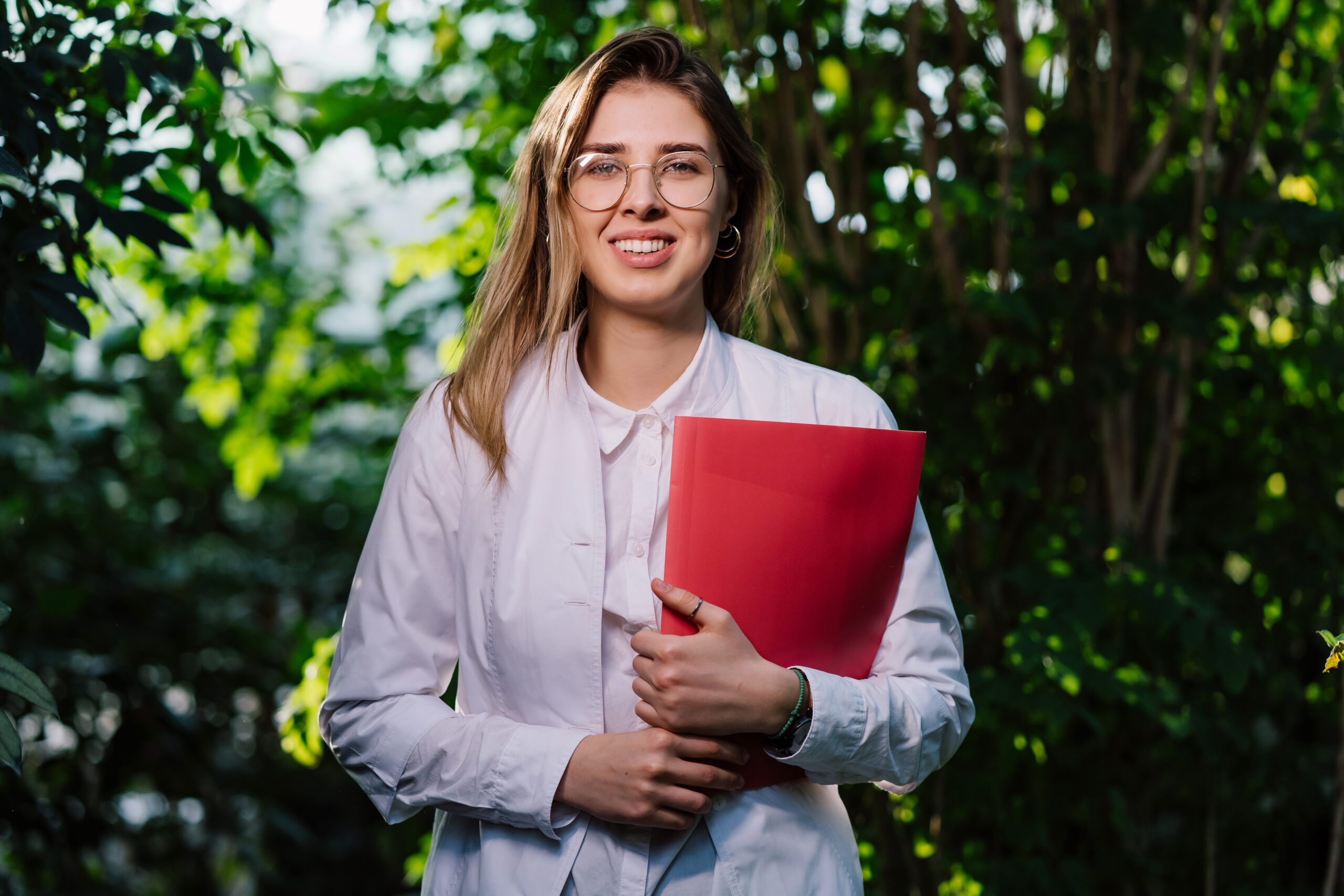 Young Female Scientist In Greenhouse Researching Plants